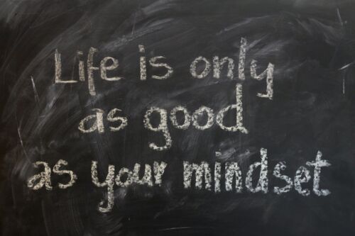 A black chalkboard depicts the message, “Life is only as good as your mindset.”
