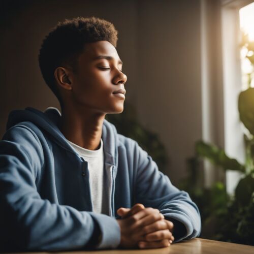 A teenager praying to God in his room.