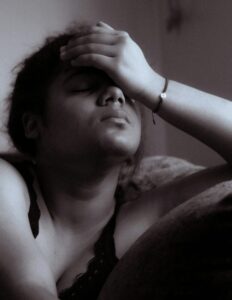 Exasperated woman suffering from “black fatigue”.
